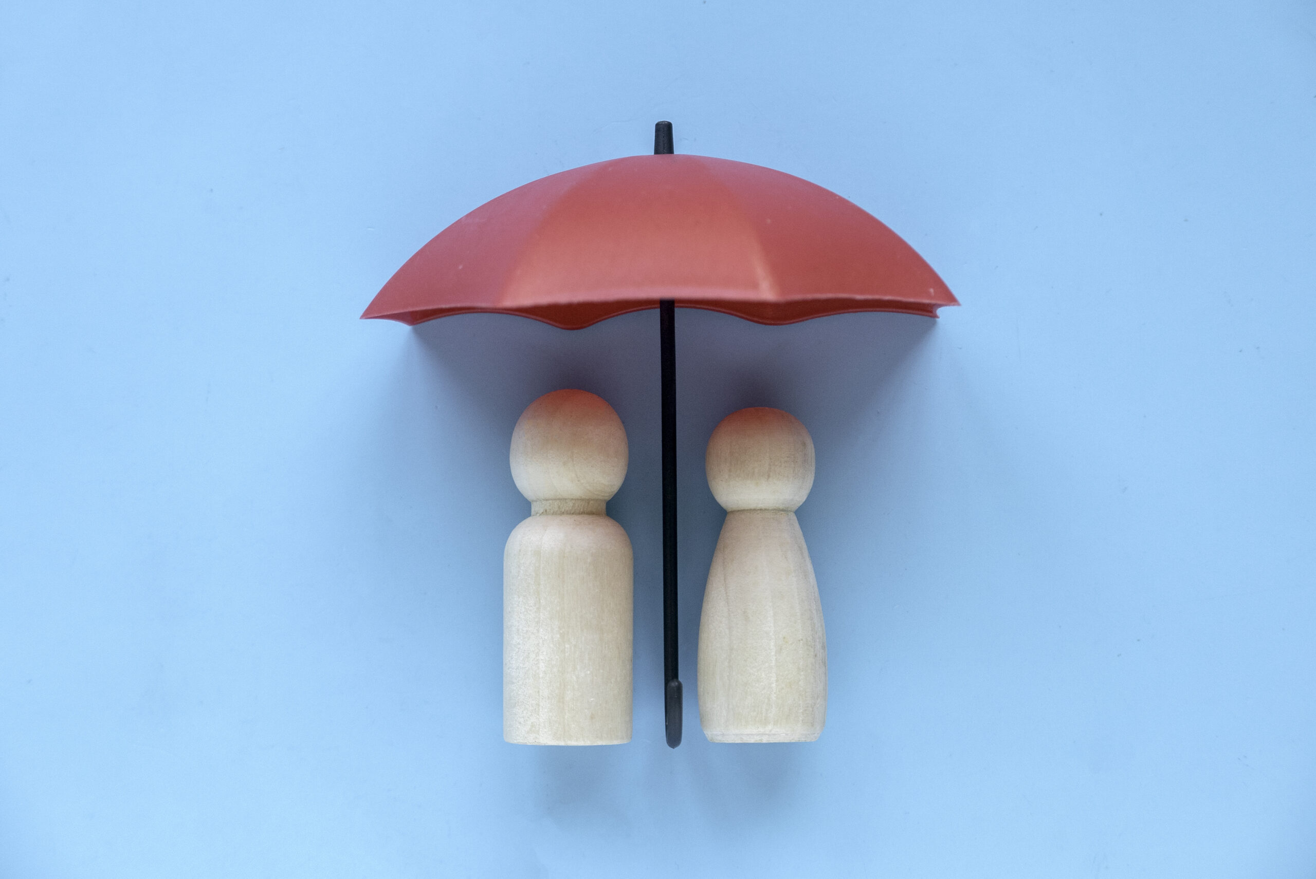 Umbrella protecting two people illustration